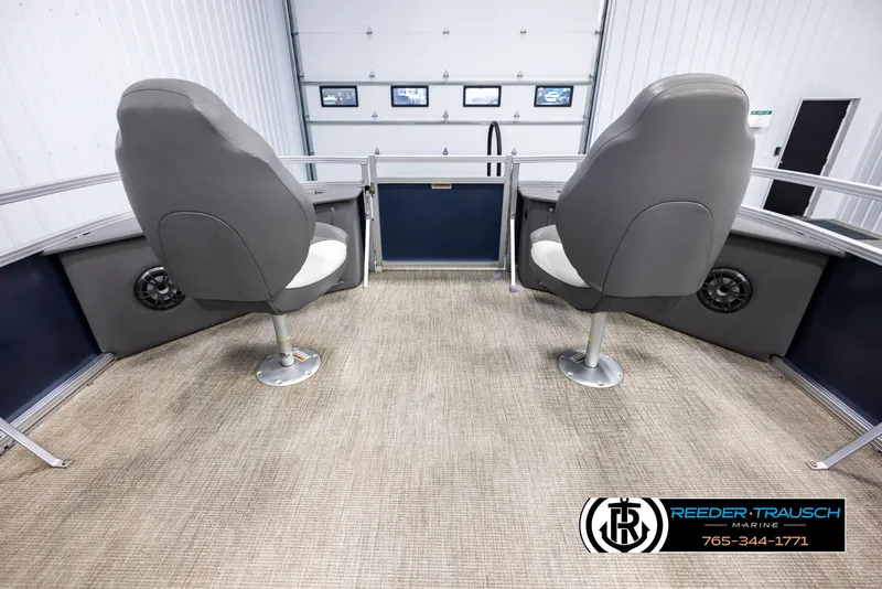 Slide: The Image of 2024 Avalon VEN QF boat interior with two gray seats and carpeted flooring. - 18