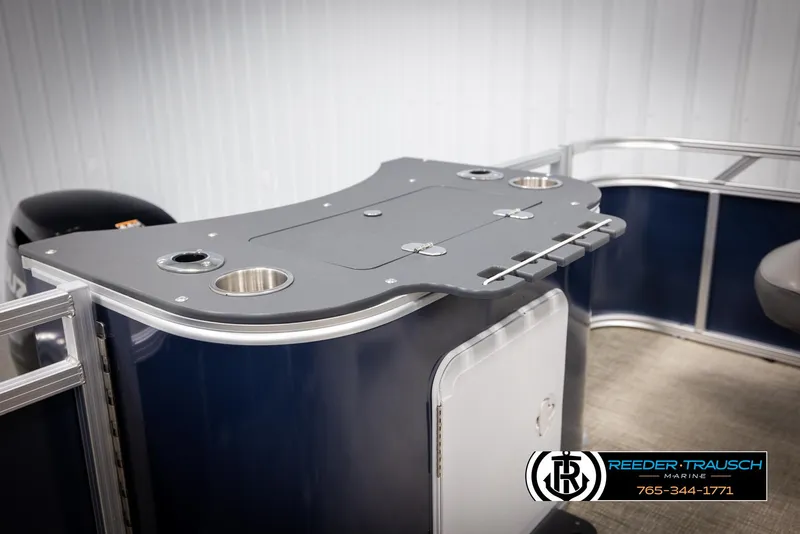 Slide: The Image of 2024 Avalon VEN QF boat interior with sleek bar and cup holders. - 24