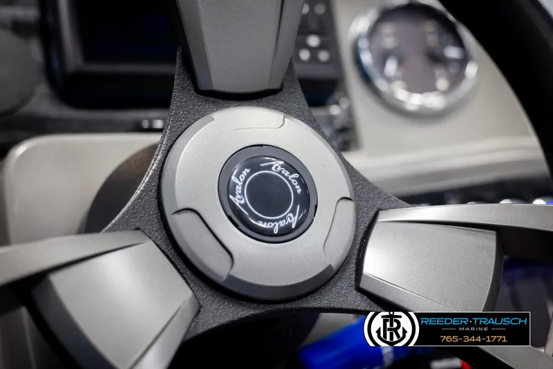 Slide: The Image of Steering wheel of 2024 Avalon VEN QF boat, featuring sleek design and branding. - 28