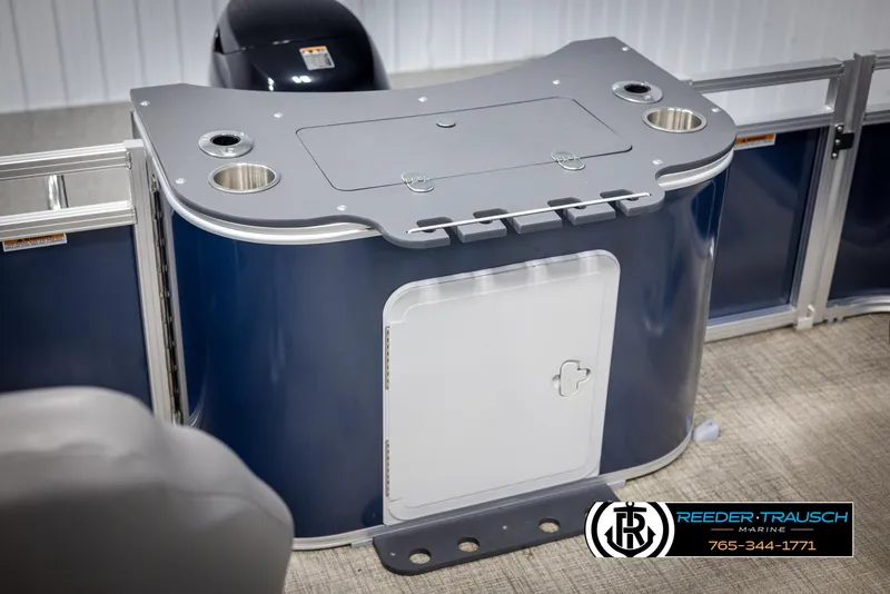 Slide: The Image of 2024 Avalon VEN QF boat console with storage and cup holders. - 38