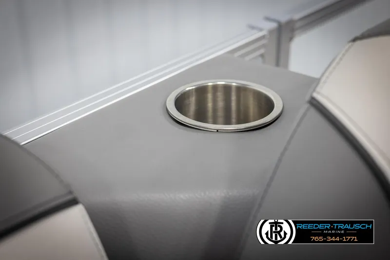Slide: The Image of 2024 Avalon VEN QF boat interior with cup holder, Reeder-Trausch Marine logo. - 41