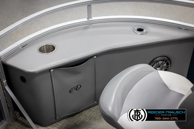 Slide: The Image of 2024 Avalon VEN QF boat interior with cup holder and storage compartment. - 44