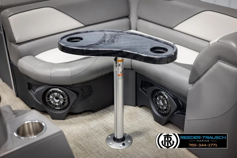 Slide: The Image of 2024 Avalon VEN QF boat interior with sleek table and built-in speakers. - 45