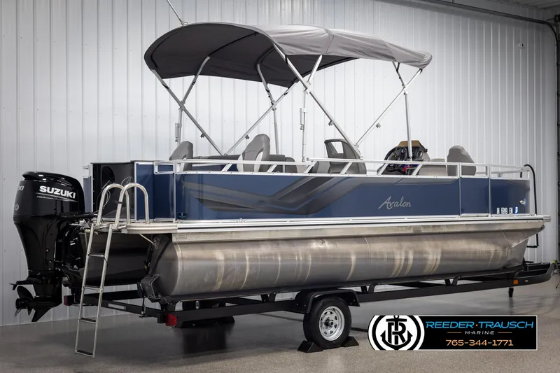 Slide: The Image of 2024 Avalon VEN QF pontoon boat with Suzuki motor on trailer in showroom. - 6