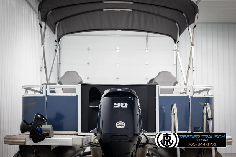 Slide: The Image of 2024 Avalon VEN QF pontoon boat with 90 HP engine in a showroom. - 7