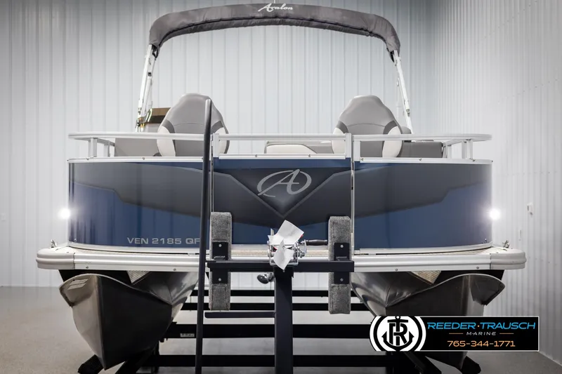Slide: The Image of 2024 Avalon VEN QF pontoon boat on display in a showroom. - 8