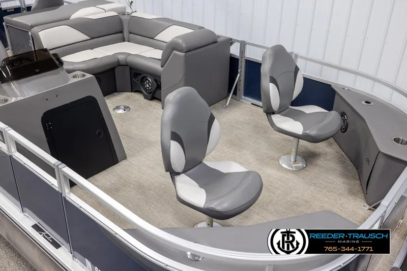 Slide: The Image of 2024 Avalon VEN QF pontoon boat interior with gray seating and carpeted floor. - 9