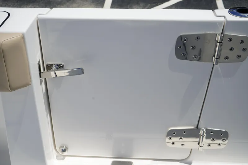 Slide: The Image of Livewell on 2025 Edgewater 340CC boat, featuring open hatch and clear water. - 13