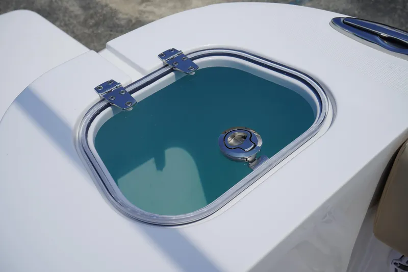 Slide: The Image of 2025 Edgewater 340CC boat with beige foldable bench seat and modern design. - 15