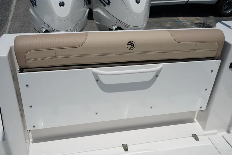 Slide: The Image of 2025 Edgewater 340CC boat compartment with mechanical components and wiring. - 17