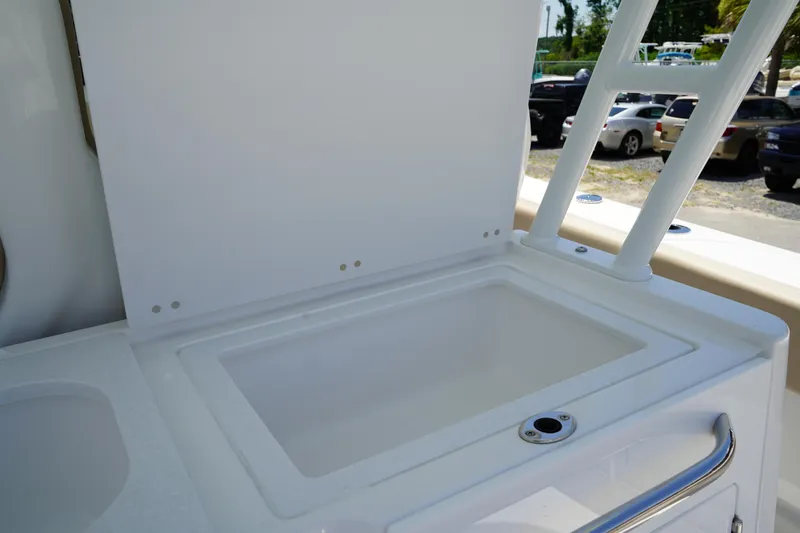 Slide: The Image of 2025 Edgewater 340CC boat ceiling with speaker and light fixtures against blue sky. - 32