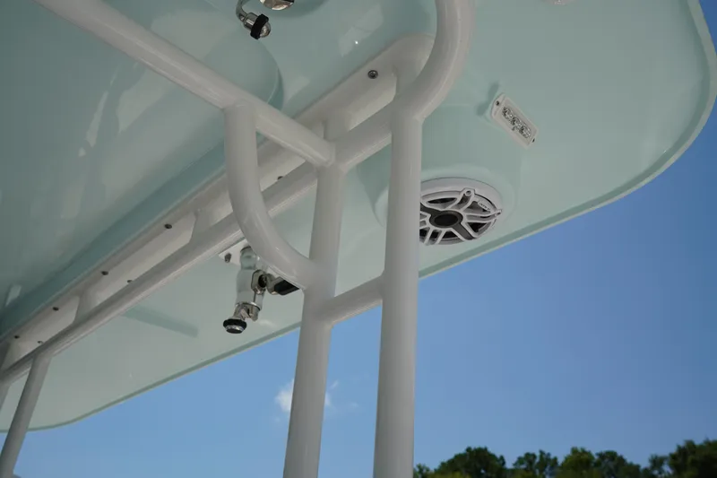 Slide: The Image of 2025 Edgewater 340CC boat storage compartments with sleek design and secure latches. - 38