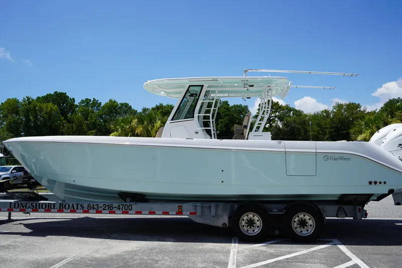 Slide: The Image of 7-year warranty promotion for Edgewater 340CC 2025 boat, featuring a marlin illustration. - 4