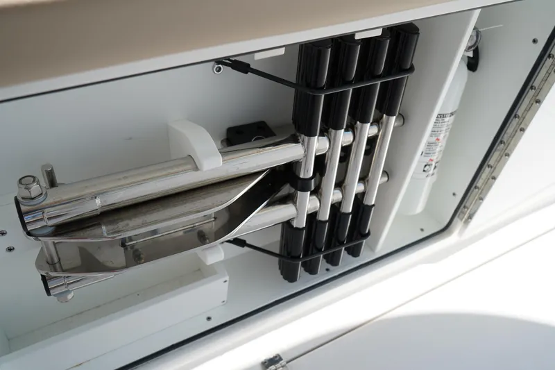 Slide: The Image of Open storage compartment on 2025 Edgewater 340CC boat, showcasing spacious interior design. - 47