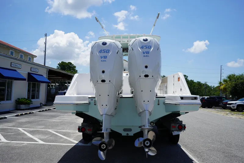 Slide: The Image of Edgewater 340CC 2025 boat with SmartPlug electrical outlets and warning label. - 8