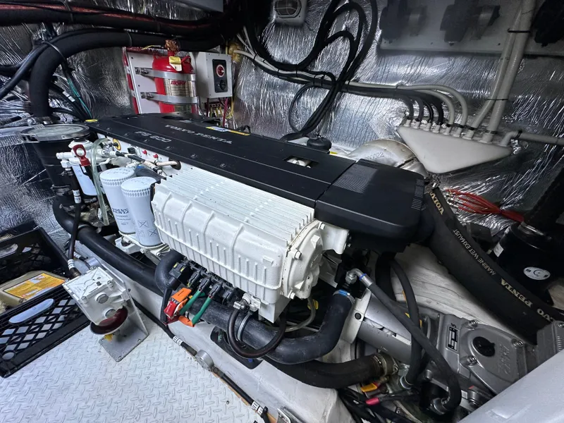 Slide: The Image of Engine compartment of 2014 Cruisers Yachts 48 Cantius with visible mechanical components. - 40