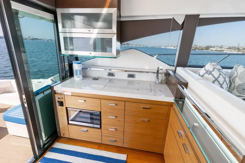 Slide: The Image of Modern kitchen interior on 2017 Tiara Yachts 53 Coupe with ocean view. - 10
