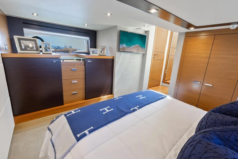 Slide: The Image of Luxurious bedroom interior of 2017 Tiara Yachts 53 Coupe with modern decor and wooden cabinetry. - 23