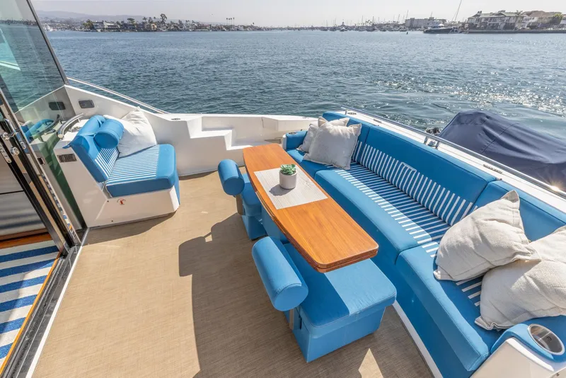 Slide: The Image of Luxurious 2017 Tiara Yachts 53 Coupe with elegant blue seating and ocean view. - 27