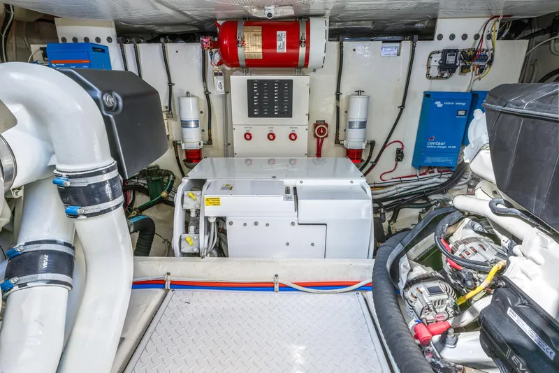 Slide: The Image of Engine room of 2017 Tiara Yachts 53 Coupe, featuring mechanical and electrical systems. - 28