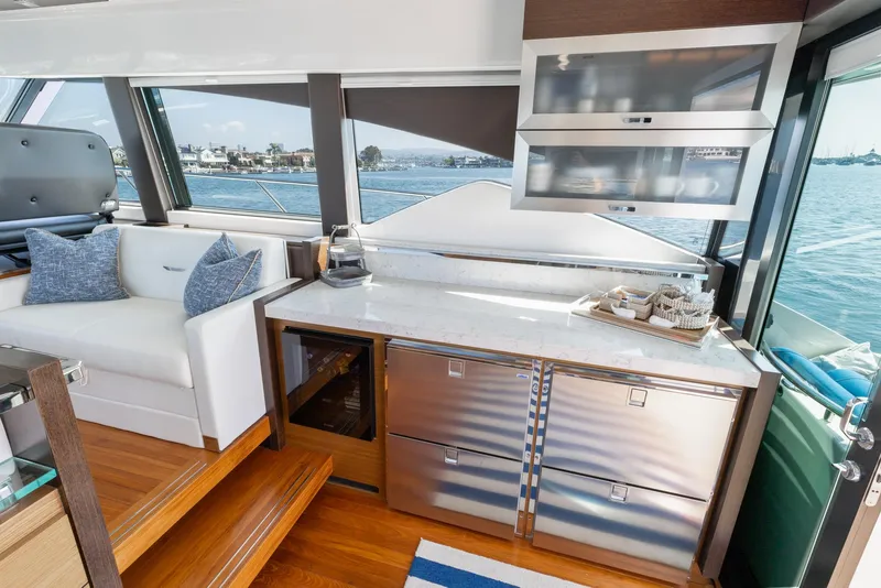 Slide: The Image of Interior of 2017 Tiara Yachts 53 Coupe with modern kitchen and ocean view. - 9