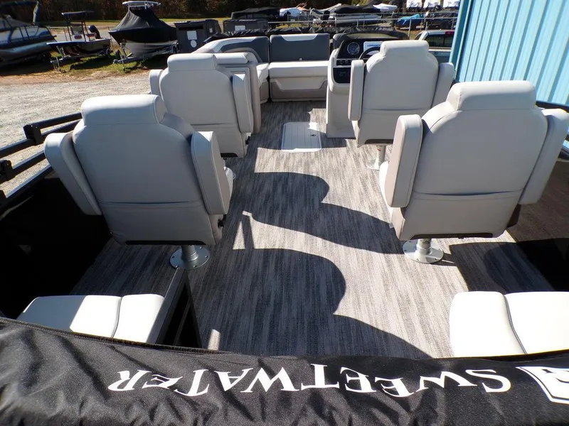 Slide: The Image of 2025 Godfrey Sweetwater 2286 QS pontoon boat interior with plush seating and modern design. - 15