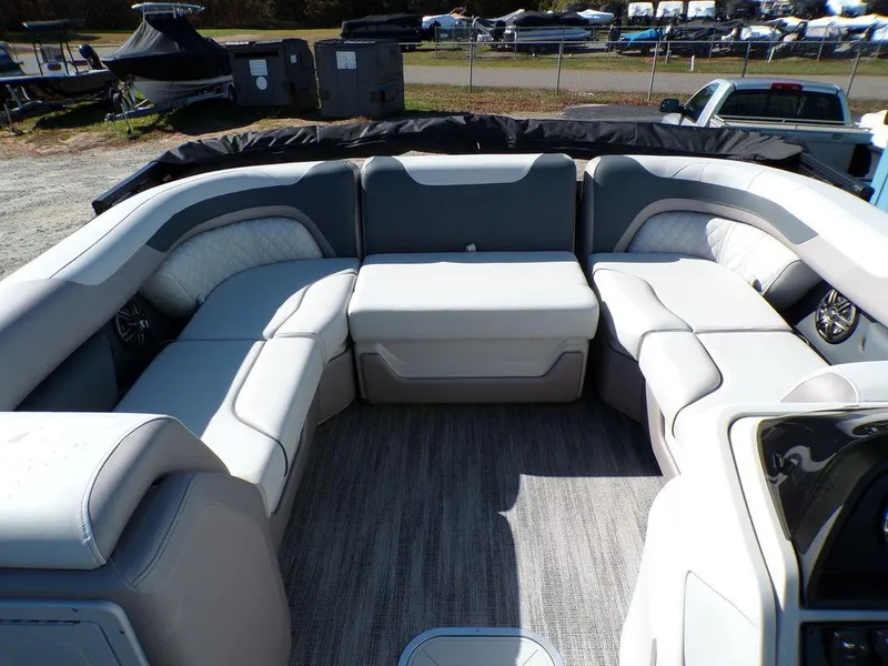 Slide: The Image of 2025 Godfrey Sweetwater 2286 QS boat interior with plush seating and modern design. - 22