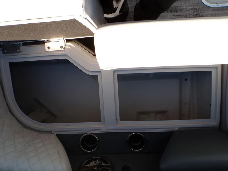 Slide: The Image of Interior view of 2025 Godfrey Sweetwater 2286 QS boat, featuring storage compartments and seating. - 23