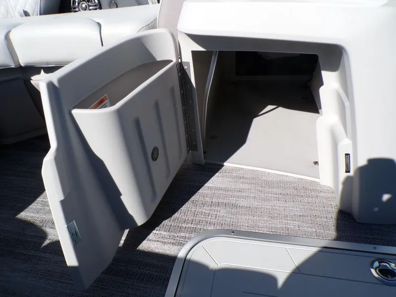 Slide: The Image of Open storage compartment on 2025 Godfrey Sweetwater 2286 QS boat, featuring modern interior design. - 28