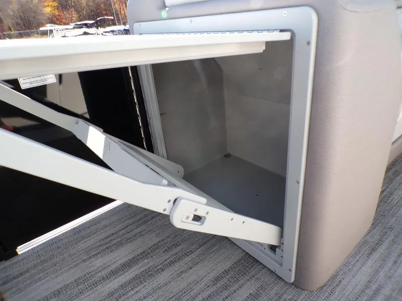 Slide: The Image of Open storage compartment on 2025 Godfrey Sweetwater 2286 QS pontoon boat. - 31