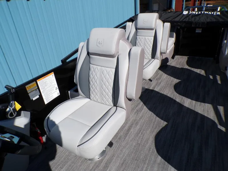 Slide: The Image of 2025 Godfrey Sweetwater 2286 QS boat seats with quilted design and gray upholstery. - 32