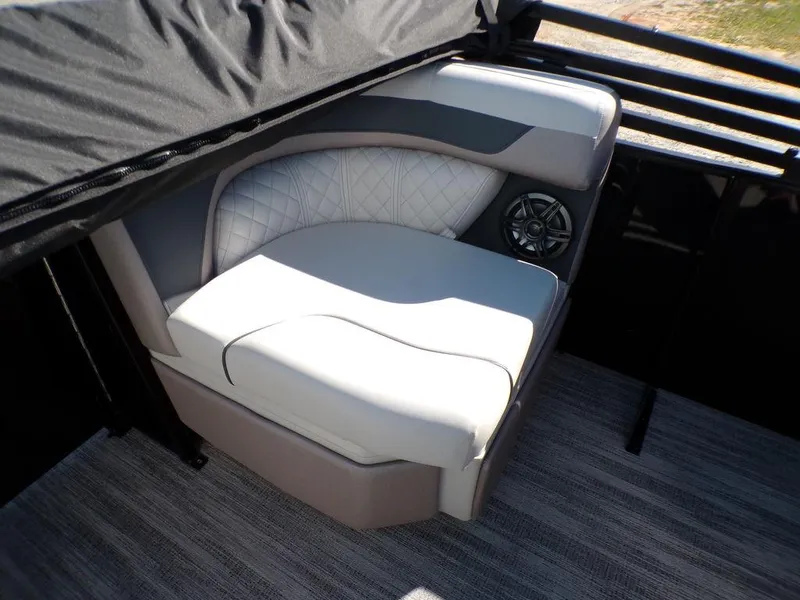 Slide: The Image of 2025 Godfrey Sweetwater 2286 QS boat interior seating with speaker, featuring quilted upholstery. - 36