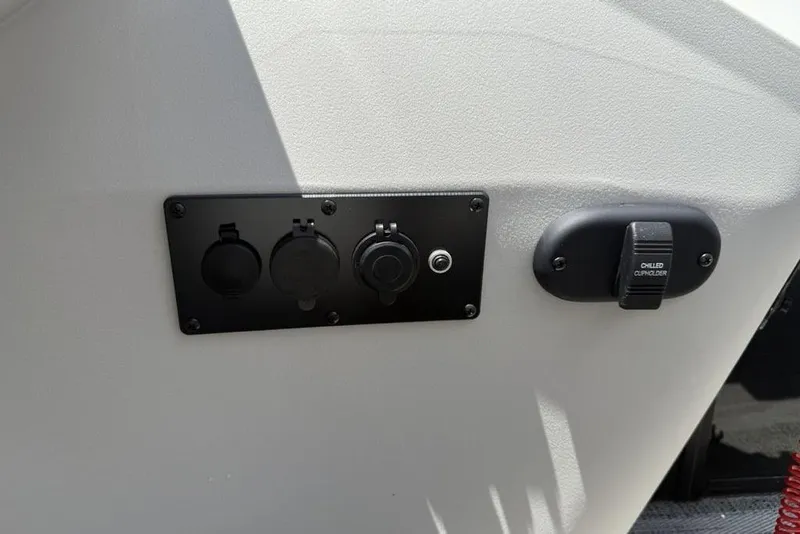 Slide: The Image of Control panel on 2025 Godfrey Sweetwater 2286 QS boat with chilled cupholder feature. - 44