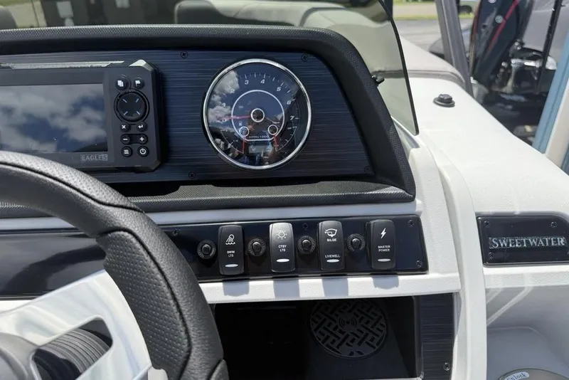 Slide: The Image of Dashboard of 2025 Godfrey Sweetwater 2286 QS boat with controls and gauges. - 45