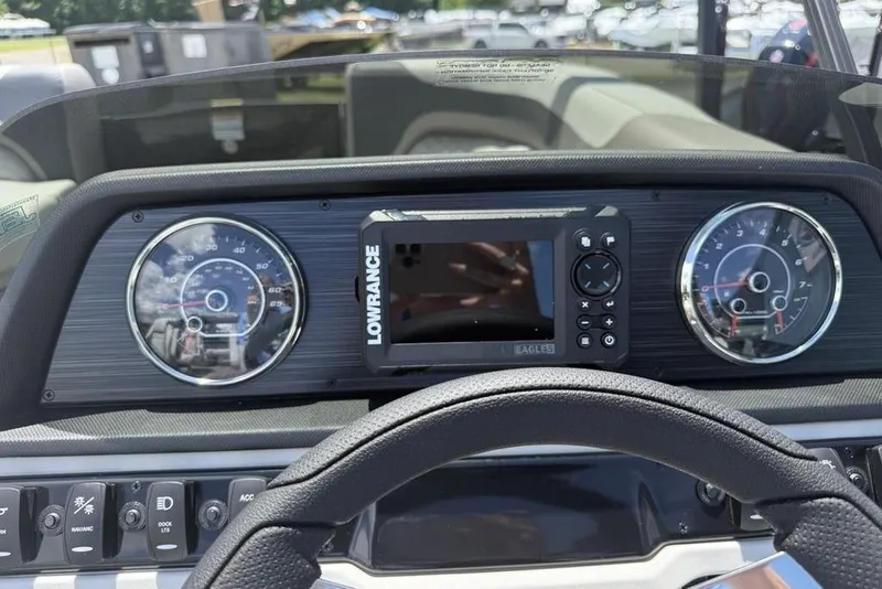 Slide: The Image of Dashboard of 2025 Godfrey Sweetwater 2286 QS boat with Lowrance display and gauges. - 47