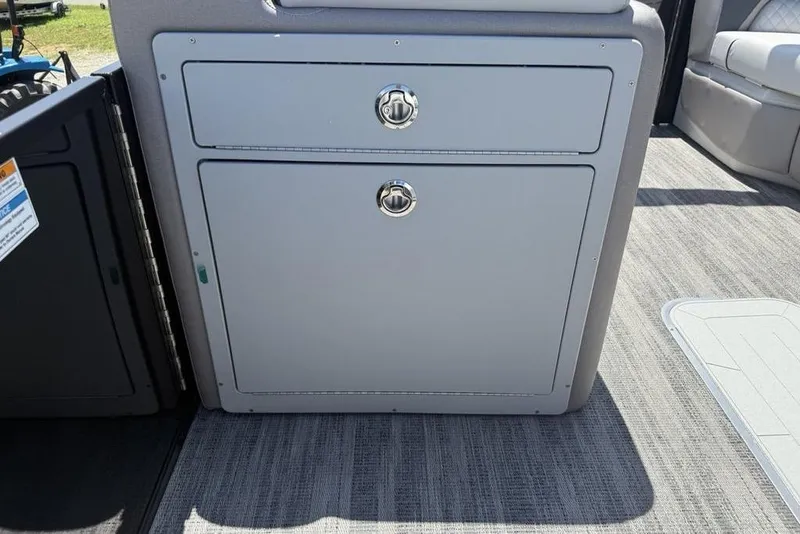 Slide: The Image of Storage compartment on 2025 Godfrey Sweetwater 2286 QS pontoon boat, featuring sleek design. - 50