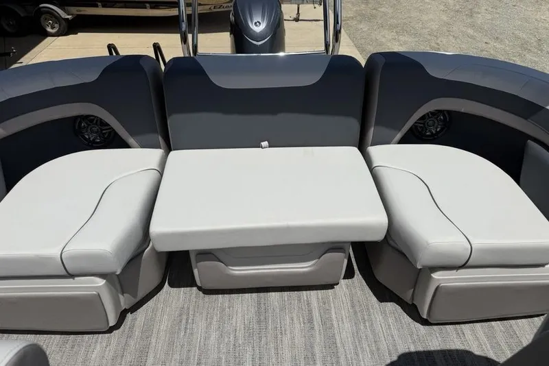 Slide: The Image of Interior seating of 2025 Godfrey Sweetwater 2286 QS pontoon boat, featuring plush gray upholstery. - 53