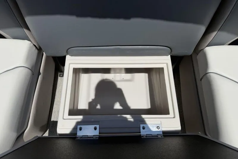 Slide: The Image of Storage compartment in 2025 Godfrey Sweetwater 2286 QS boat, featuring sleek seating design. - 54