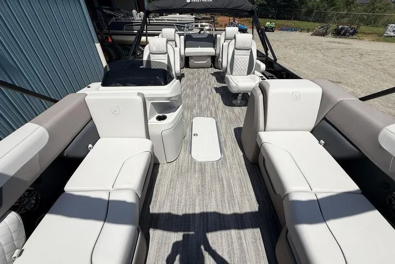 Slide: The Image of 2025 Godfrey Sweetwater 2286 QS pontoon boat interior with plush seating and modern design. - 55