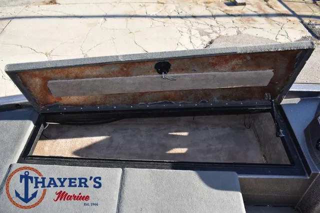 Slide: The Image of Open storage compartment on 1997 Skeeter ZX202C boat at Thayer's Marine. - 12