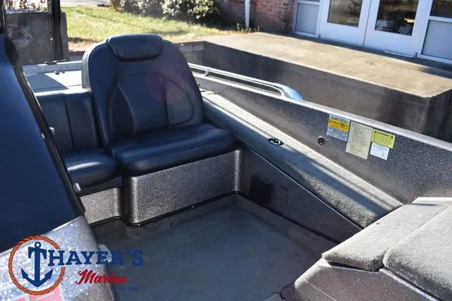 Slide: The Image of 1997 Skeeter ZX202C boat interior with seating, Thayer's Marine logo visible. - 16