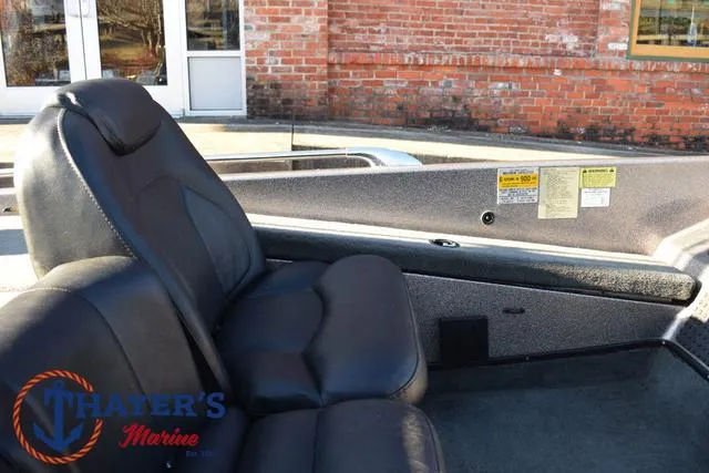 Slide: The Image of 1997 Skeeter ZX202C boat interior with black seats, Thayer's Marine logo visible. - 17