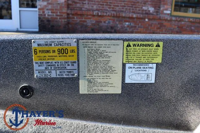 Slide: The Image of Warning labels on 1997 Skeeter ZX202C boat, maximum capacity 6 persons or 900 lbs. - 18