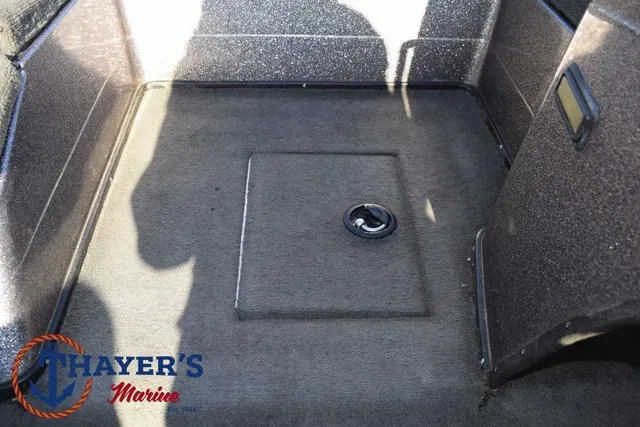 Slide: The Image of 1997 Skeeter ZX202C boat interior with storage compartment, Thayer's Marine logo visible. - 19