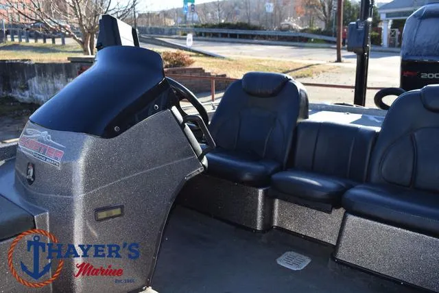 Slide: The Image of 1997 Skeeter ZX202C boat interior with steering console and seating, Thayer's Marine logo visible. - 21