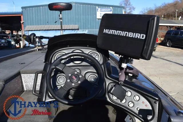 Slide: The Image of 1997 Skeeter ZX202C boat dashboard with Humminbird fish finder at Thayer's Marine. - 24