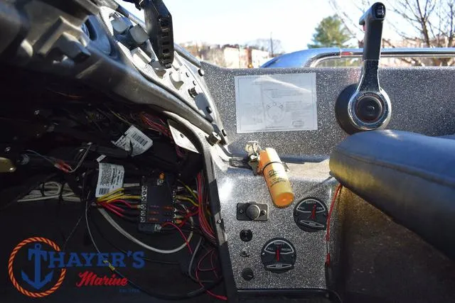 Slide: The Image of 1997 Skeeter ZX202C boat dashboard with controls and wiring, Thayer's Marine logo visible. - 25