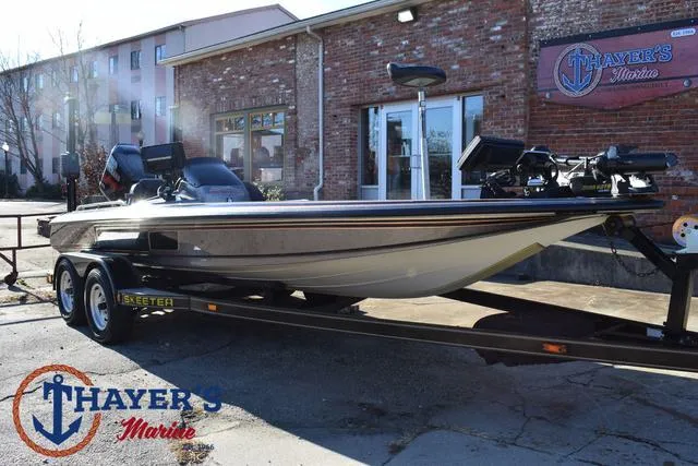 Slide: The Image of 1997 Skeeter ZX202C boat on trailer at Thayer's Marine dealership. - 32