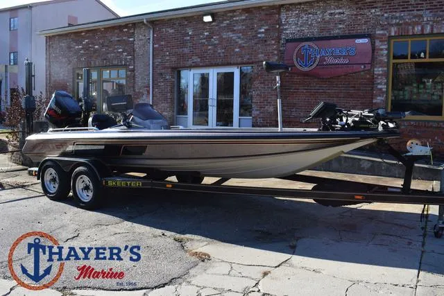 Slide: The Image of 1997 Skeeter ZX202C boat on trailer at Thayer's Marine dealership. - 35