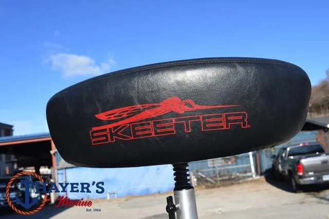 Slide: The Image of 1997 Skeeter ZX202C boat seat with logo, outdoors at Thayer's Marine. - 9